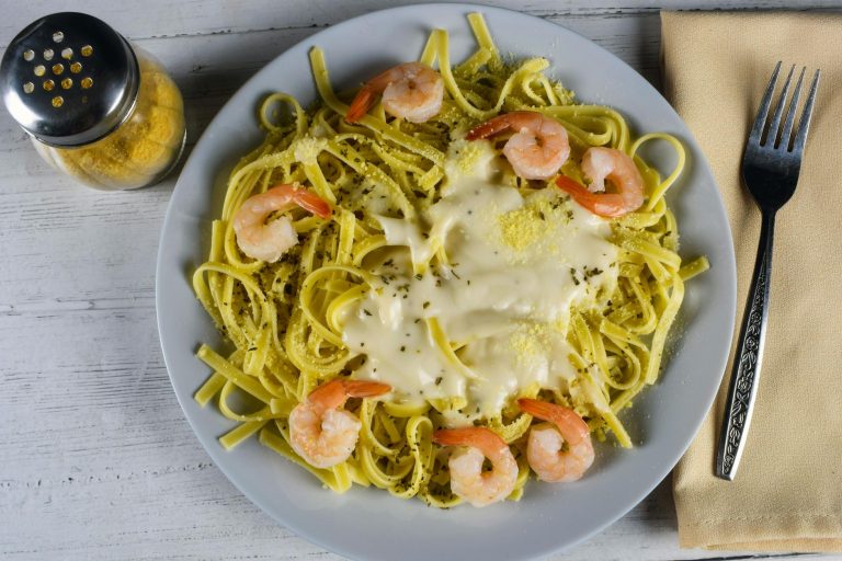 Creamy garlic butter shrimp pasta with parmesan, parsley, and tender shrimp in a rich sauce