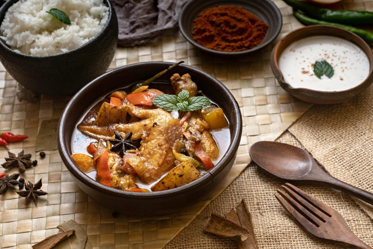 Cozy Filipino comfort bowl with chicken, rice, egg, and scallions in a white bowl
