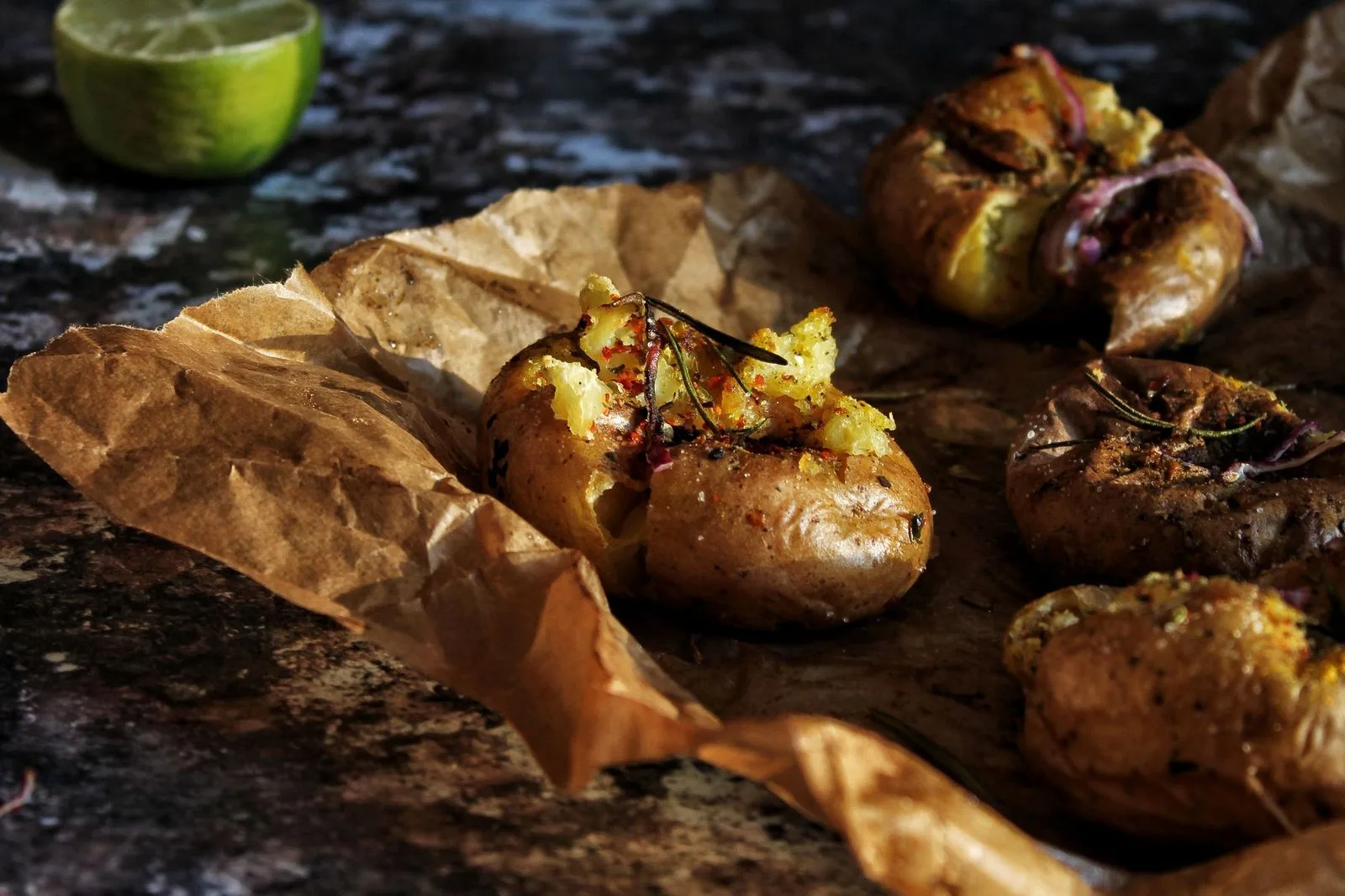 Crispy baked potatoes on brown paper