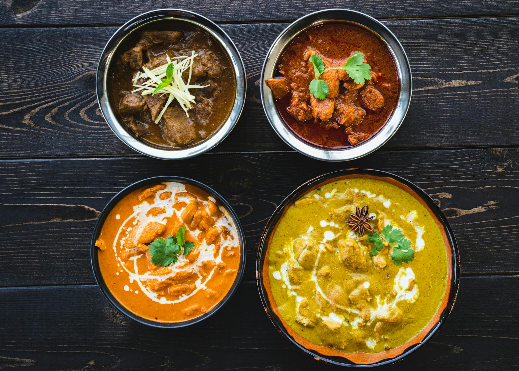 Authentic chicken tikka masala served over basmati rice with naan and cilantro garnish