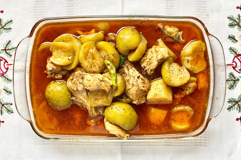 Authentic Ethiopian doro wat served with hard-boiled eggs and injera in a bowl