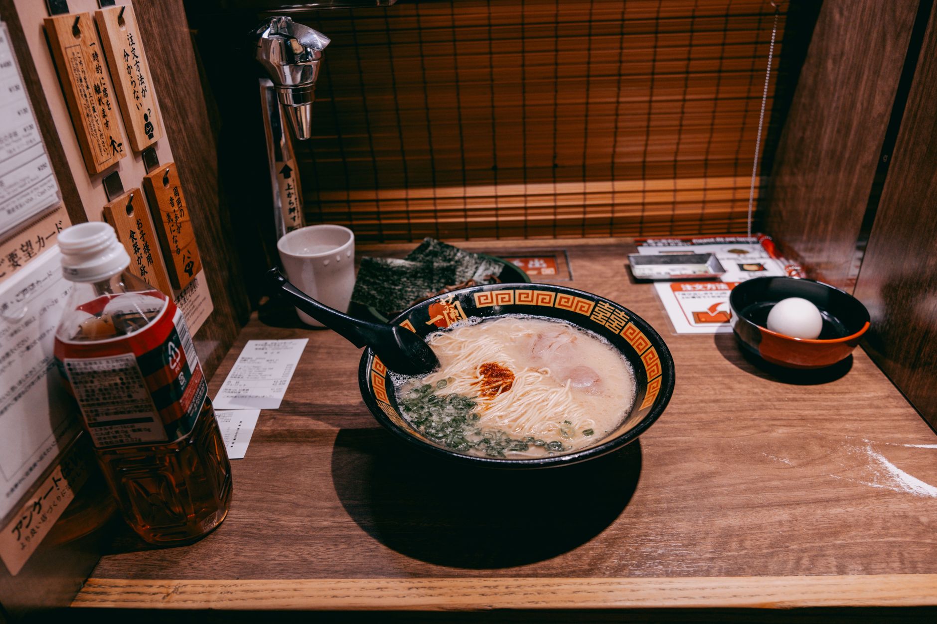 Creamy authentic tonkotsu ramen broth served in a bowl with noodles and toppings