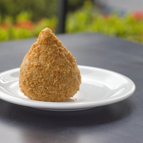 Crispy Brazilian chicken coxinha croquettes served golden brown on a plate