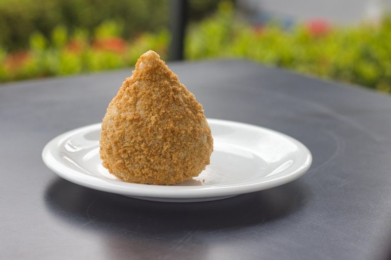 Crispy Brazilian chicken coxinha croquettes served golden brown on a plate